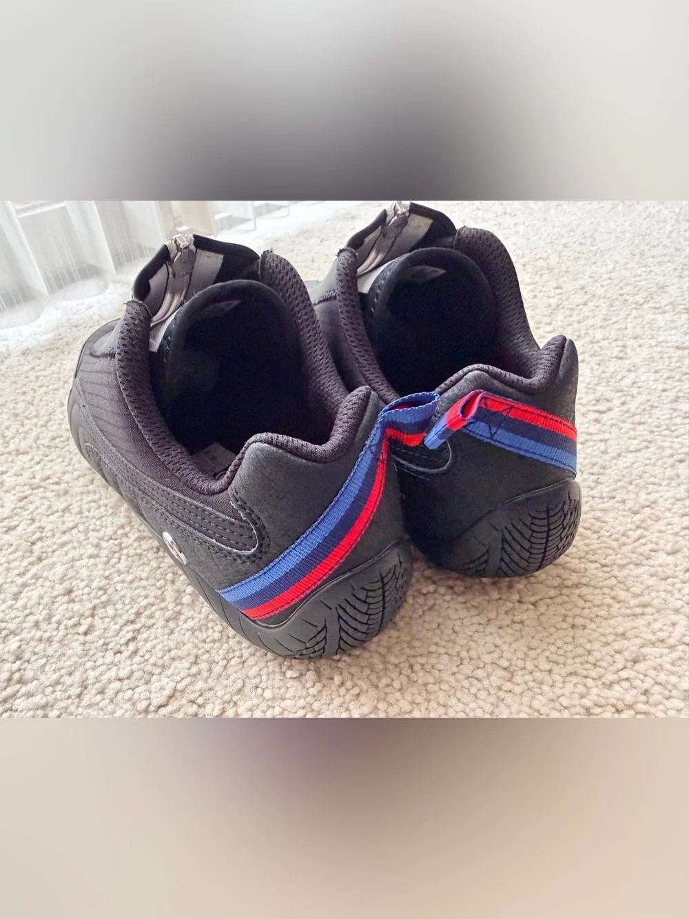Puma Black low-profile Sneakers with Red & Blue Heel Accents